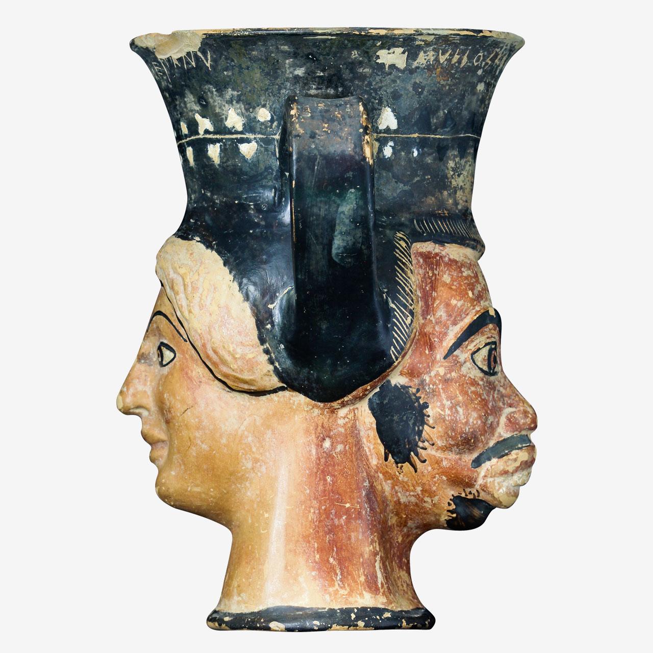 Clay Attic double-headed kantharos, attributed to the Syriskos Painter. Incised inscriptions above the two diametrically opposed modeled faces: “I am Eronassa, very beautiful”, and “I am Timyllos, as handsome as this face”.